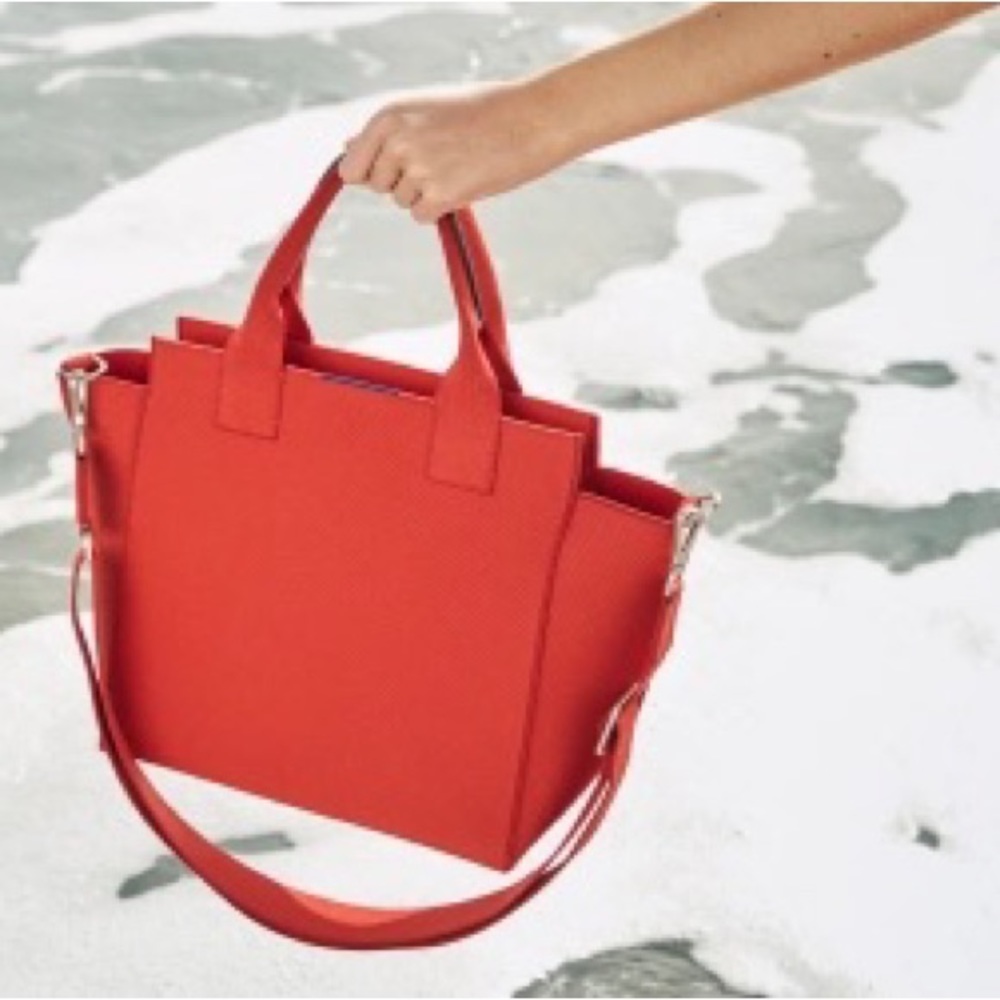 Rothy’s “The Handbag” Crossbody Tote in Poppy Red.